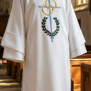 White dalmatic with embroidered design in a church setting