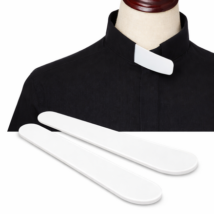 White collar and two white straps on a black shirt with a mannequin head.